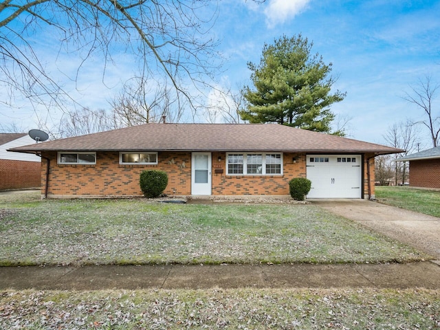 ranch-style home with a garage and a front yard