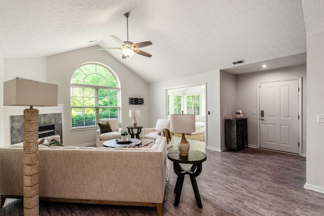 4248 Bridgelane Pl Unit 8-4248, New Albany, OH 43054 - living room featuring dark wood finished floors, ceiling fan, a textured ceiling, lofted ceiling, and a fireplace