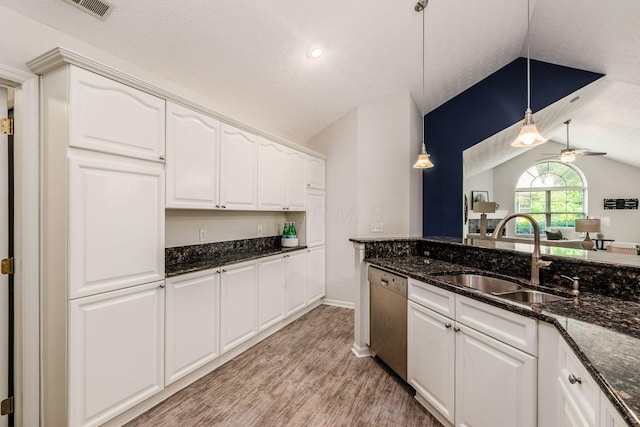 4248 Bridgelane Pl Unit 8-4248, New Albany, OH 43054 - kitchen featuring stainless steel dishwasher, lofted ceiling, light wood finished floors, white cabinets, and hanging light fixtures