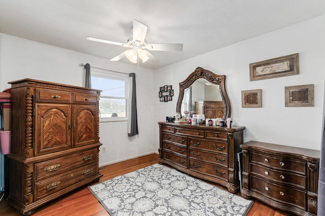 bedroom with ceiling fan and light hardwood / wood-style flooring