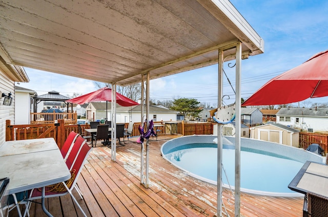 deck featuring a storage shed and a gazebo