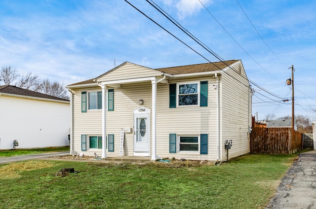 split foyer home with a front lawn