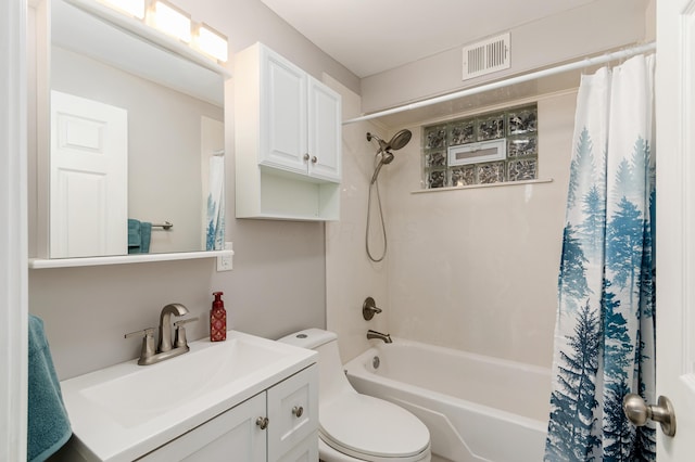 full bathroom featuring vanity, shower / tub combo, and toilet