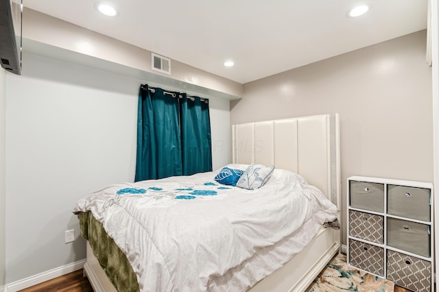 bedroom with hardwood / wood-style flooring