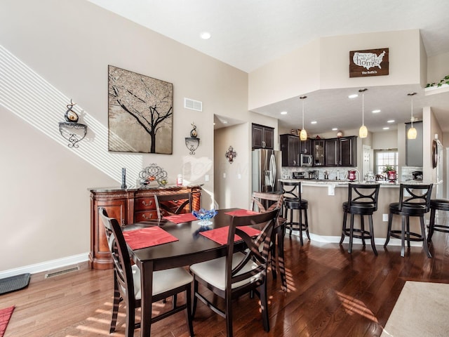 dining room with hardwood / wood-style floors