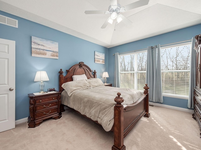 bedroom with lofted ceiling, light carpet, and ceiling fan