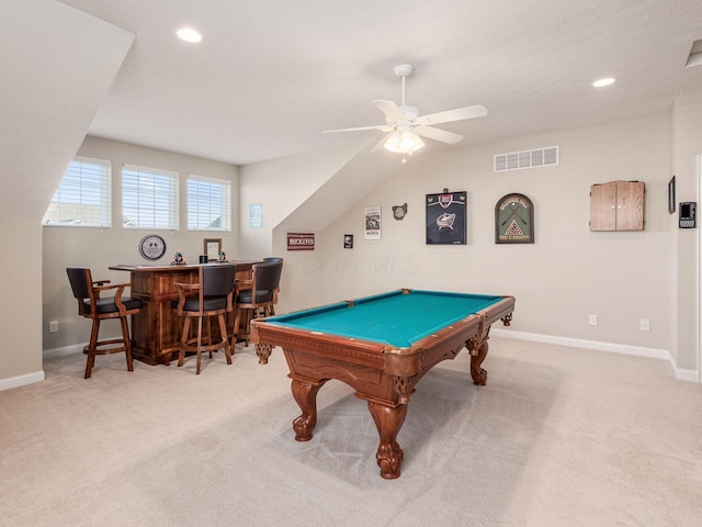 game room with pool table, light colored carpet, ceiling fan, and bar area