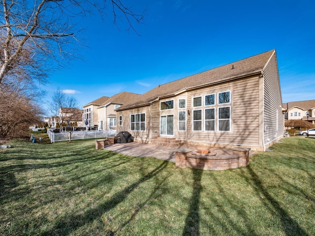 back of property featuring a patio and a yard