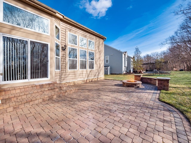 view of patio featuring a fire pit