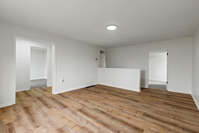 unfurnished room featuring light hardwood / wood-style floors