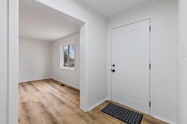 entryway with light hardwood / wood-style floors