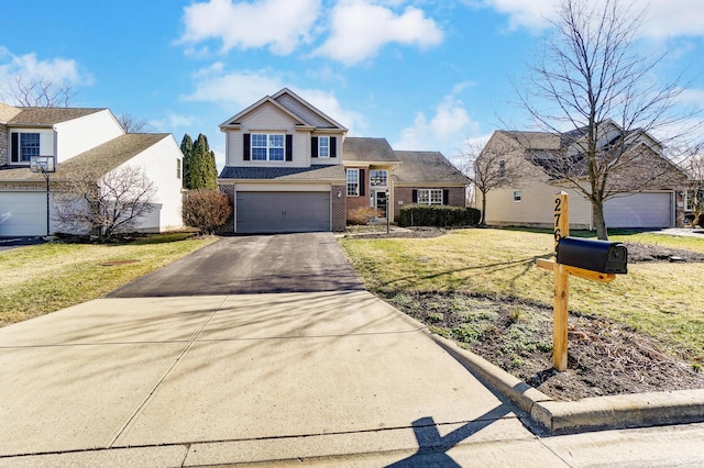 view of front property with a garage and a front yard