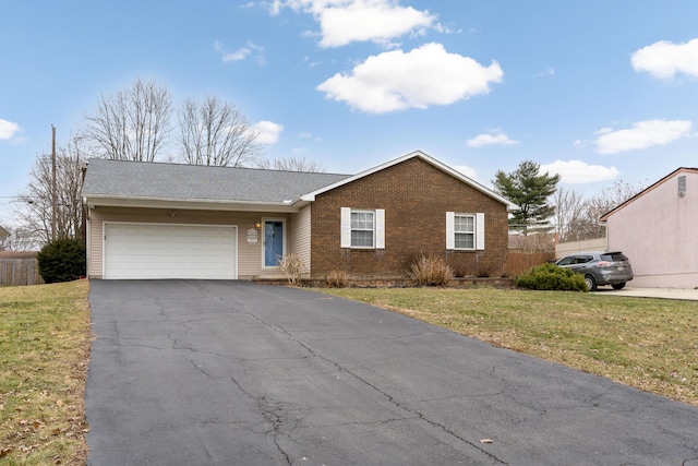 ranch-style house with a garage and a front lawn