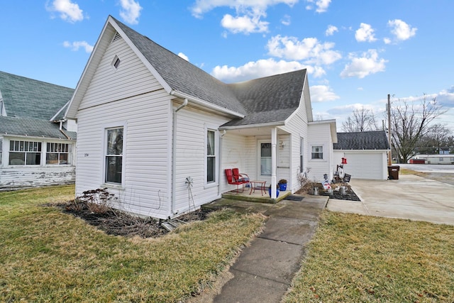 bungalow-style house featuring a garage and a front yard