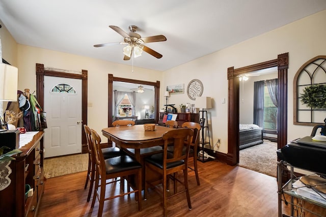 dining space featuring wood-type flooring