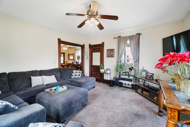 living room featuring carpet flooring and ceiling fan