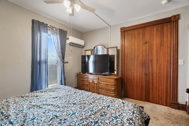 bedroom featuring carpet flooring, a wall mounted AC, and ceiling fan