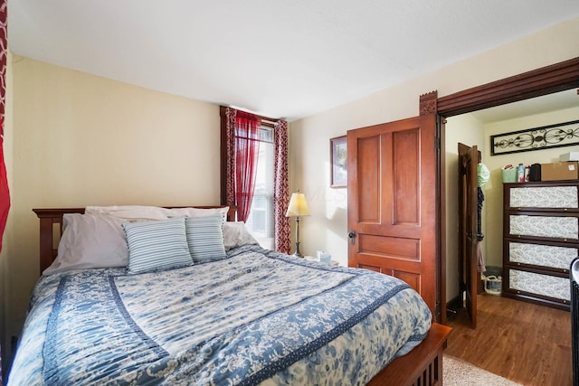 bedroom featuring wood-type flooring