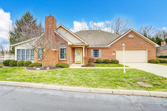 view of front facade with a garage and a front lawn