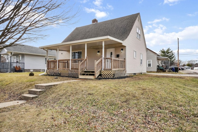 view of front of property with a front lawn and covered porch