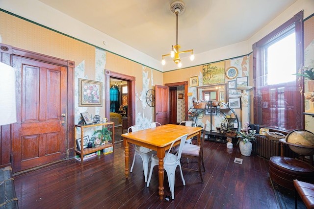 dining area with wood-type flooring