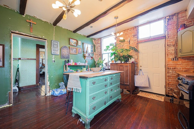 miscellaneous room featuring brick wall, dark wood-type flooring, beam ceiling, and a notable chandelier