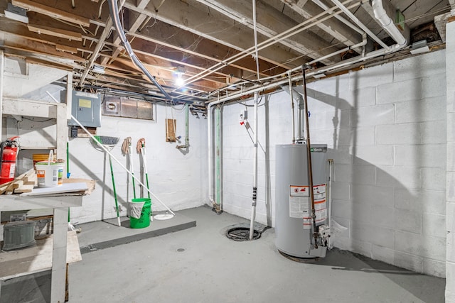 basement featuring electric panel and gas water heater