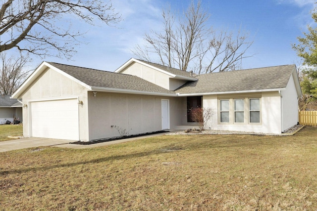 ranch-style house with a garage and a front yard