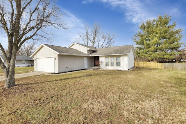 view of front of home featuring a garage and a front lawn