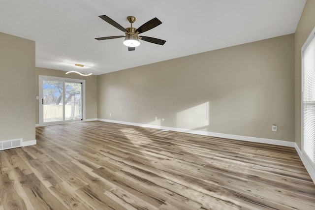 unfurnished room with light hardwood / wood-style floors and ceiling fan