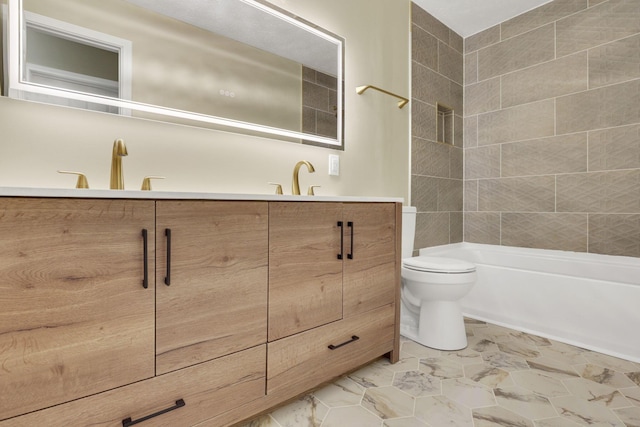 full bathroom with tiled shower / bath combo, vanity, and toilet