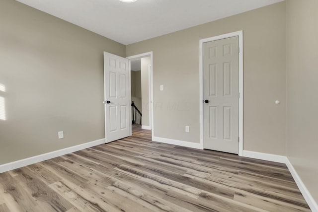 unfurnished bedroom featuring light hardwood / wood-style flooring