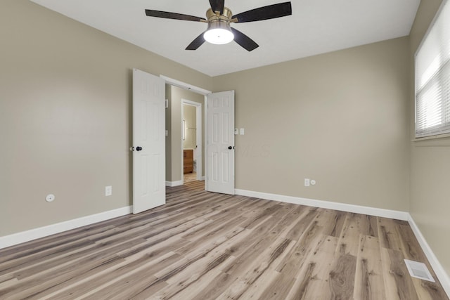 unfurnished room featuring light hardwood / wood-style floors and ceiling fan