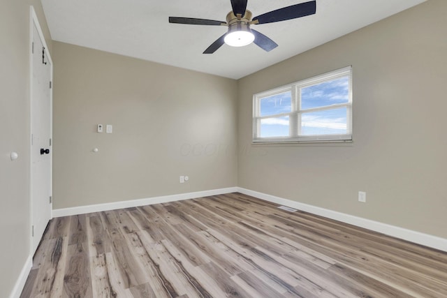 spare room with ceiling fan and light hardwood / wood-style floors