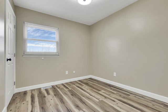 empty room with light wood-type flooring