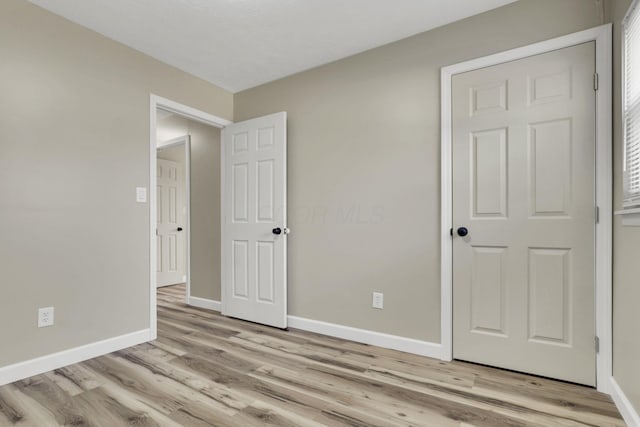 unfurnished bedroom with light hardwood / wood-style floors