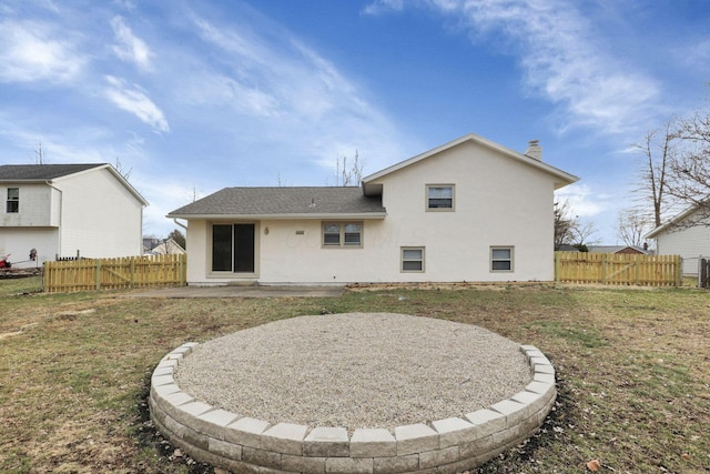 back of house featuring a yard and a patio area