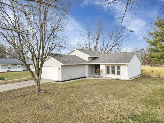 view of front facade with a garage and a front yard