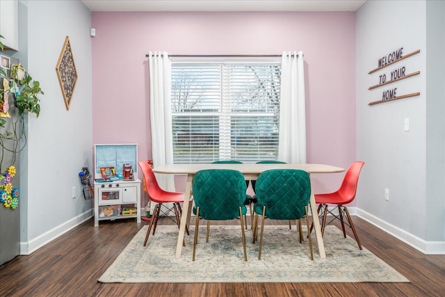 dining area featuring dark wood-type flooring