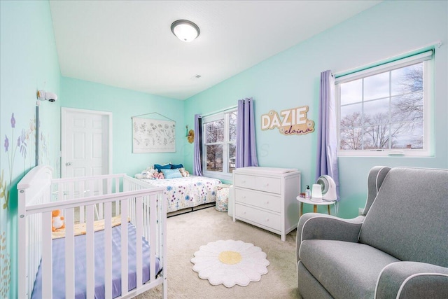 bedroom with light colored carpet