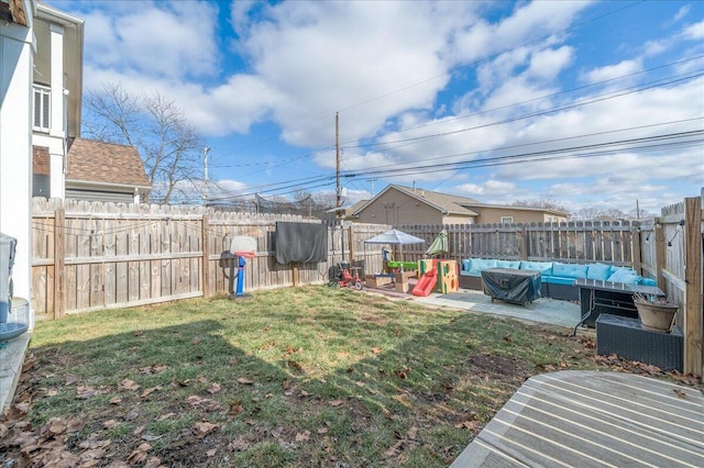 view of yard with a patio area, a fenced backyard, and an outdoor hangout area