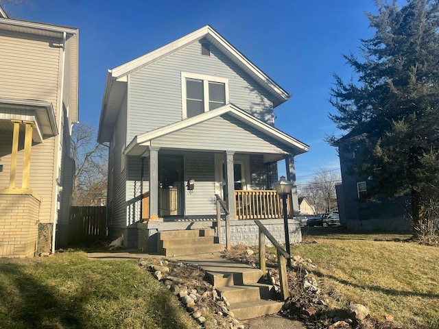 view of front of house with a front lawn and a porch