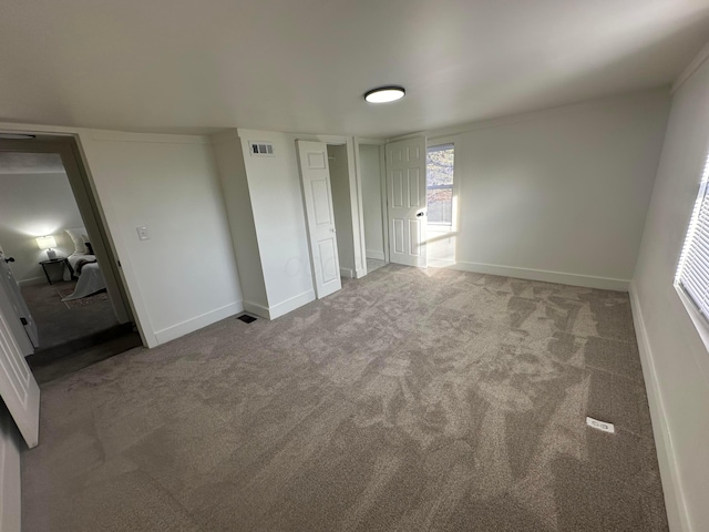 unfurnished bedroom featuring light colored carpet