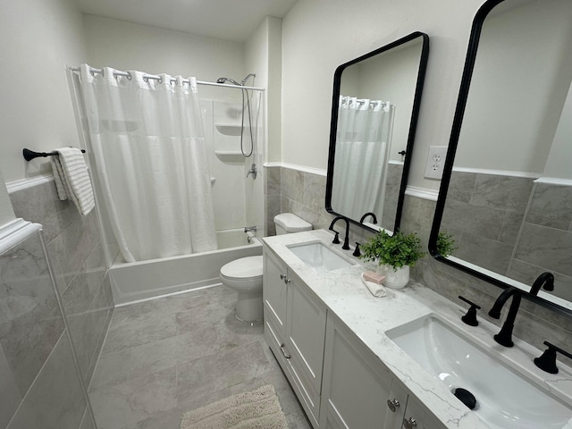 full bathroom featuring vanity, tile walls, shower / bath combination with curtain, and toilet