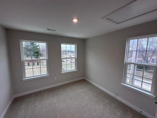 unfurnished room featuring carpet flooring