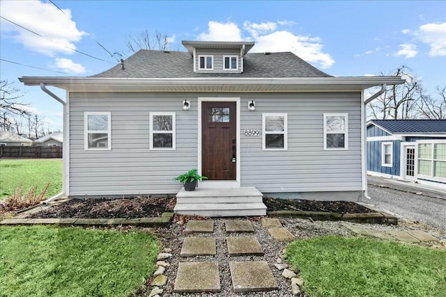 bungalow with a front lawn