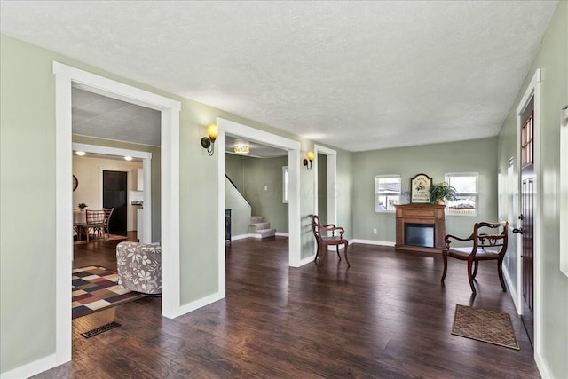 8899 Walnut St, Lakeview, OH 43331 - living area featuring a textured ceiling and dark hardwood / wood-style flooring