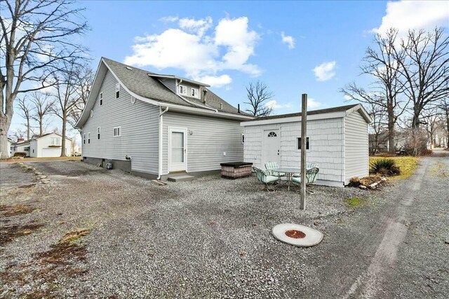 8899 Walnut St, Lakeview, OH 43331 - rear view of house featuring an outbuilding