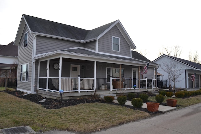 view of front of property featuring a porch and a front lawn