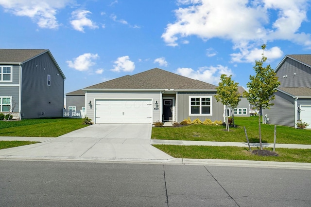 view of front facade featuring a garage and a front lawn